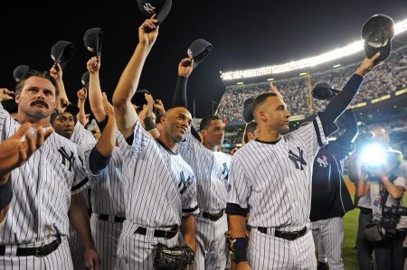 21 September 2008: Last game ever at Yankee Stadium. Yankees play the Orioles in the Final Game ever to be played in Yankee Stadium: Yankee Captain Derek Jeter surounded by his teammates including (Jason Giambi and Mariano Rivera) salute the Yankee crowd after the game. (Photo by Anthony J. Causi/Icon SMI/Corbis via Getty Images)